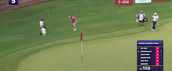 Eugenio Chacarra chips in at the 5th hole