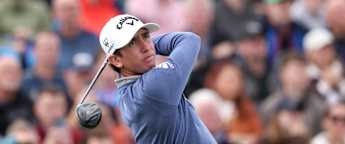 Tom McKibbin holes his pitch shot for birdie at the 13th