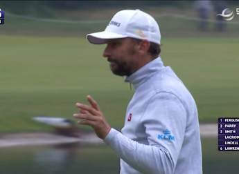 Joost Luiten holes a putt from distance on the 15th