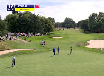 Kazuma Kobori holes long-range eagle putt at the par five 17th to close the gap at the top to one shot 