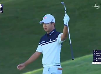 Seungbin Choi chips in from off the green at the 14th