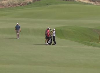 Andy Sullivan throws dart at the 18th
