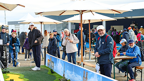 Fans enjoy the activities in the fan village