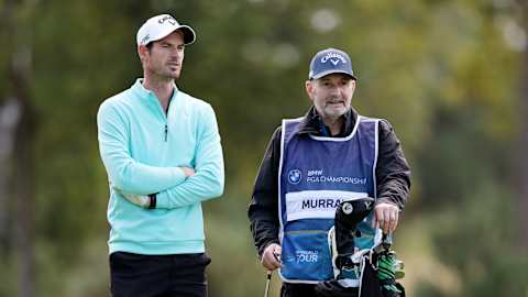 Andy Murray stands with his dad and caddie William Murray