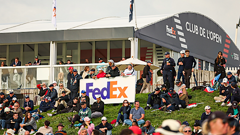 Fans enjoy the atmosphere, looking out onto the green