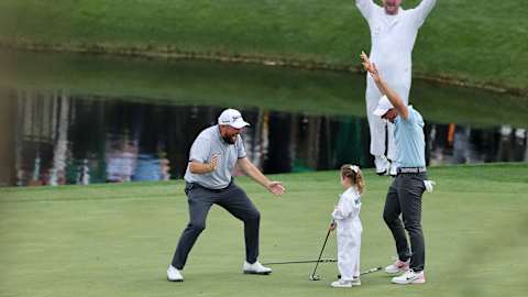 You did it, Poppy. Rory McIlroy, playing with Shane Lowry, celebrates after helping his daughter make a long birdie putt