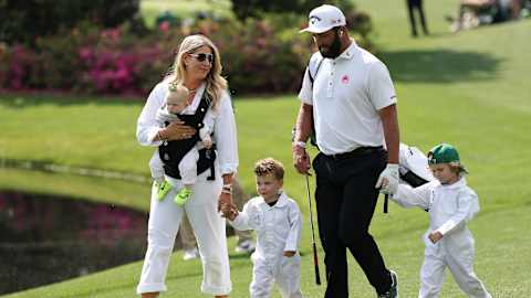 2023 Masters champion Jon Rahm and his wife Kelley walk with their sons Kepa and Eneko and daughter Alaia