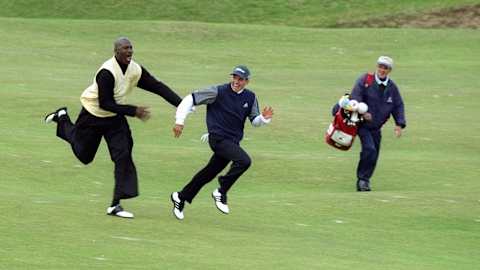 NBA great Michael Jordan chases Sergio Garcia